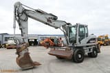2009 Caterpillar M313D wheel excavator side view