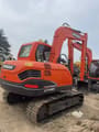 2023 Doosan DX80 mini excavator rear three-quarter view