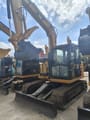 Caterpillar 308E crawler excavator, front three-quarter view
