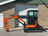 Hitachi ZX26U-6CR mini excavator, side view
