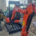 2022 Kubota U27 mini excavator, front three-quarter view