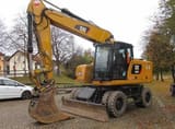 2021 Caterpillar M320 VAH wheel excavator, front three-quarter view
