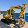 2023 Komatsu PC78US-6 mini excavator, front three-quarter view