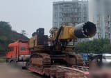 2016 Caterpillar 6015FS crawler excavator with rock saw attachment, side view