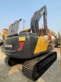 2023 Volvo EC140 crawler excavator, rear three-quarter view
