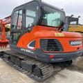 2022 Doosan DX55-9C mini excavator, rear three-quarter view