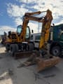 2012 New Holland MH 2.6 wheel excavator, front three-quarter view