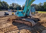 2004 Kobelco SK210NLC-6E crawler excavator, rear three-quarter view