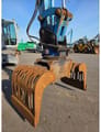 2016 Fuchs MHL331 material handler grapple attachment close-up