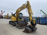 2022 Komatsu PC138US-11 crawler excavator, front three-quarter view