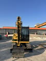 2024 Caterpillar 305.5E2 mini excavator, front view