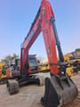 2024 Doosan DX225LC-9C crawler excavator, front three-quarter view