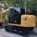2020 Caterpillar 307E2 crawler excavator, rear three-quarter view