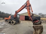 2013 Hitachi ZX140W-5 wheel excavator, front three-quarter view