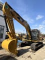 2022 Caterpillar 323D2L crawler excavator, front three-quarter view