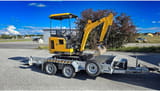 2021 JCB 16C-1 mini excavator on trailer, side view