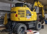 2023 Komatsu PW138MR wheel excavator, rear three-quarter view