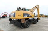 2008 Caterpillar M322D material handler, rear three-quarter view