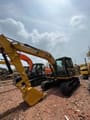 2024 Caterpillar 312 crawler excavator, front three-quarter view