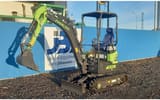 2025 Zoomlion ZE18GU Mini Excavator showing the dozer blade in its lowered position.