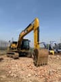 2023 Caterpillar 313D2 crawler excavator, front three-quarter view