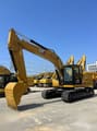 2024 Caterpillar 323 crawler excavator, front three-quarter view