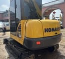 Komatsu PC56 mini excavator, rear three-quarter view