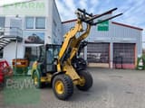 2022 Caterpillar 906-14A wheel loader with forks, front three-quarter view