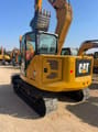 2024 Caterpillar 307.5 mini excavator, rear three-quarter view