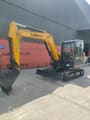 2026 LiuGong 906FG4 Mini Excavator with yellow body and black tracks, showcasing the full side profile with the boom and arm retracted.