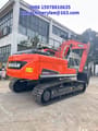 2023 Doosan DX225LCA crawler excavator, rear three-quarter view