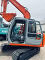 2023 Hitachi EX60 crawler excavator side view with open cab