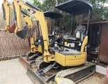 2018 Caterpillar 302C mini excavator, rear three-quarter view