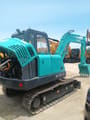 2024 Kobelco SK60-C crawler excavator, rear three-quarter view with engine cover open