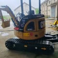 2022 Caterpillar 303E CR mini excavator, rear three-quarter view