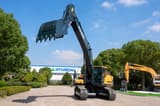 2026 Hyundai HX375L Crawler Excavator with its dark gray bucket prominently displayed, teeth facing upwards.