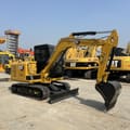 2023 Caterpillar 305.5E mini excavator, side view