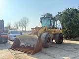 1995 Caterpillar 938F wheel loader, front three-quarter view