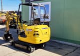 2002 Komatsu PC12R-8 mini excavator, rear three-quarter view