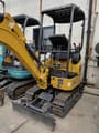 2026 XCMG XE17U Mini Excavator with its yellow boom and dozer blade extended forward.