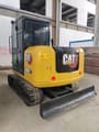 2022 Caterpillar 306E2 mini excavator, rear three-quarter view