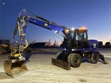 2014 Caterpillar M313D wheel excavator, side view