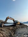 2019 Caterpillar 323 crawler excavator, side profile view