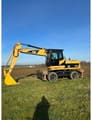 2009 Caterpillar M322D wheel excavator, side profile view