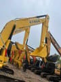 2022 Komatsu PC240-8 crawler excavator, side view of multiple machines