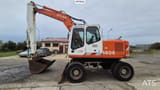 1995 Atlas 1404 wheel excavator side view