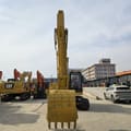 2020 Caterpillar 320BL crawler excavator, front view with boom raised