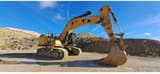 2013 Caterpillar 374FL crawler excavator, side profile view
