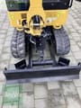 2022 Caterpillar 301.8-05A mini excavator, rear view with dozer blade