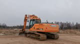 Doosan DX225LC crawler excavator, rear three-quarter view